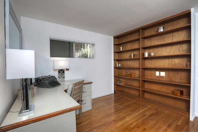 home office with wood finished floors