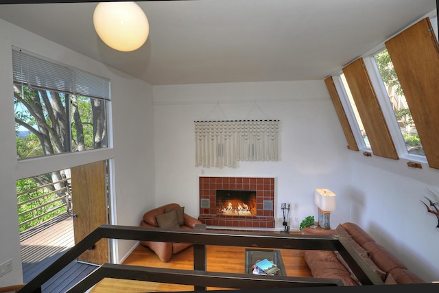 living room with a tile fireplace