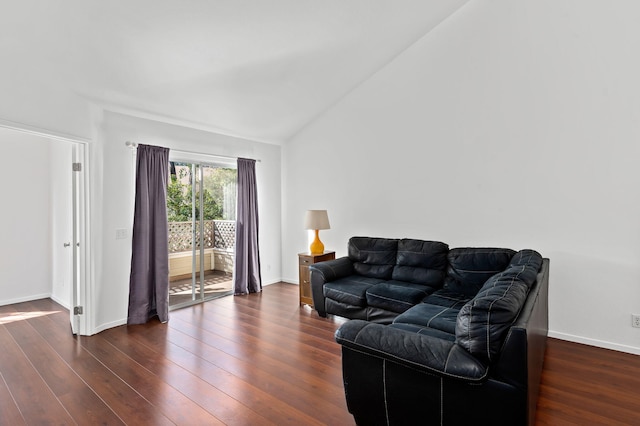 living room with vaulted ceiling and dark hardwood / wood-style flooring