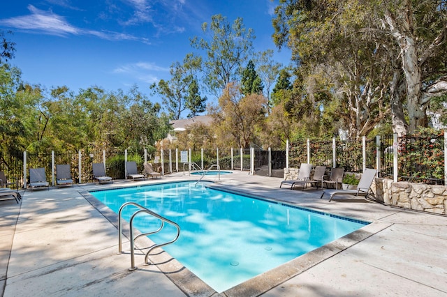 view of pool featuring a patio area