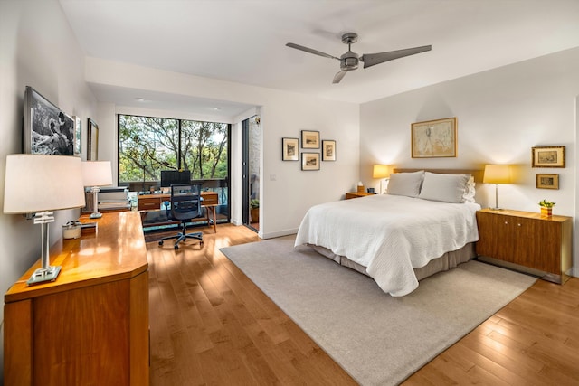 bedroom featuring ceiling fan and light hardwood / wood-style flooring