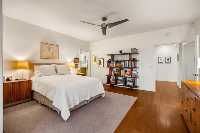 bedroom featuring dark wood-type flooring and ceiling fan