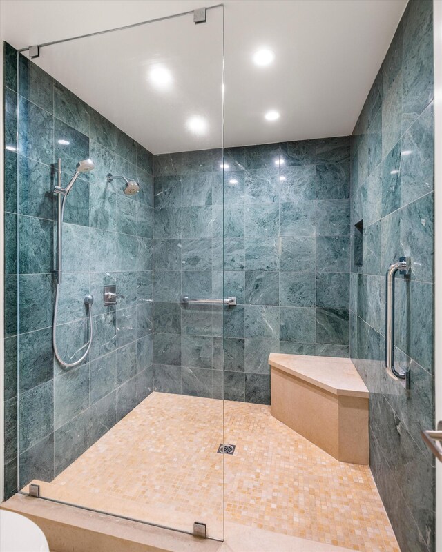 bathroom featuring recessed lighting, a shower stall, and toilet