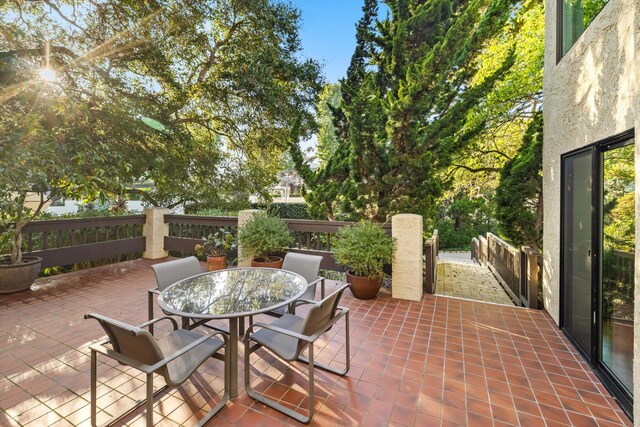 view of patio featuring outdoor dining area