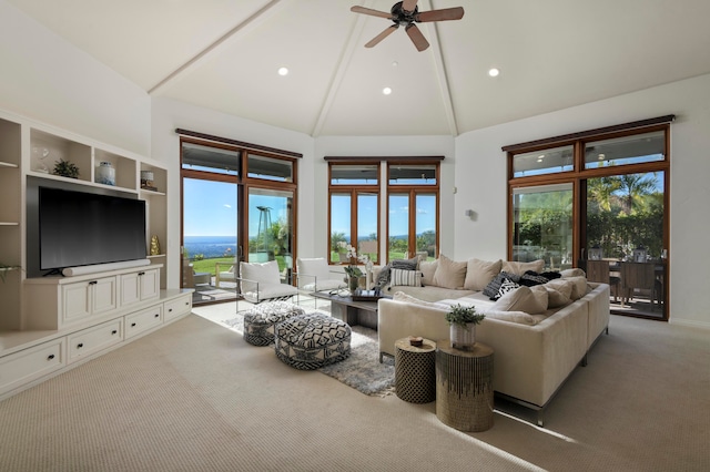 living room featuring high vaulted ceiling, carpet, and ceiling fan