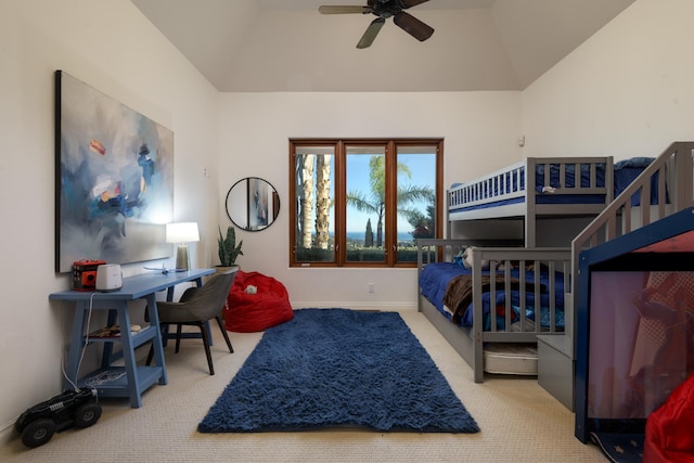 carpeted bedroom featuring ceiling fan and lofted ceiling