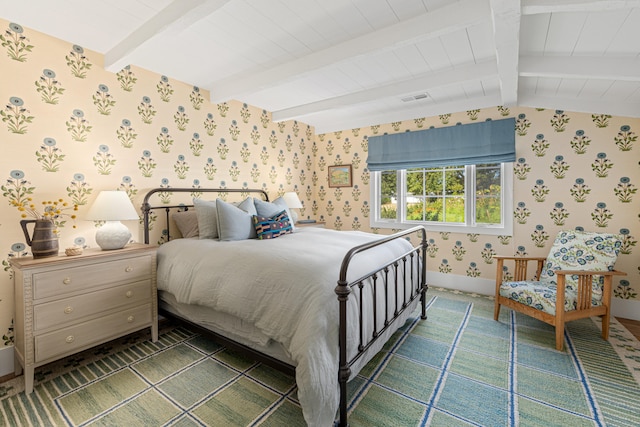 bedroom with vaulted ceiling with beams