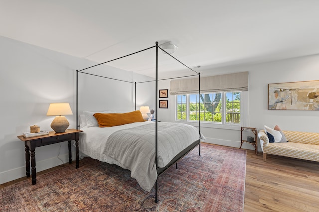 bedroom with hardwood / wood-style flooring