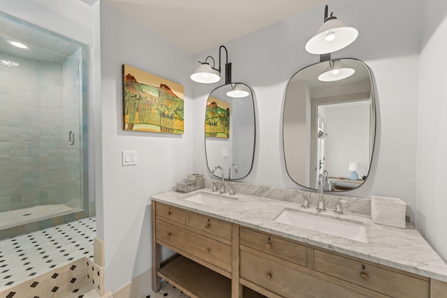 bathroom featuring vanity and a shower with shower door