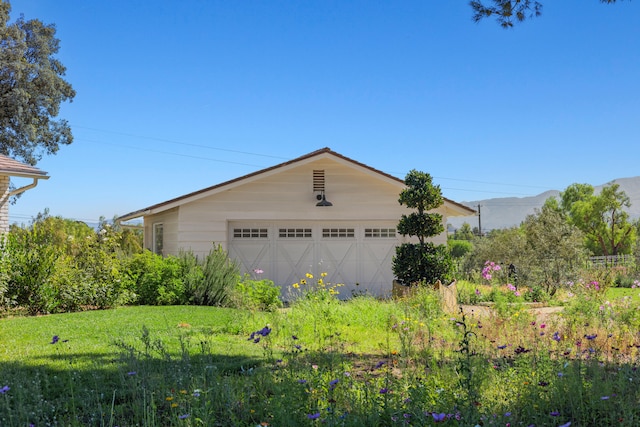 exterior space featuring an outdoor structure and a garage