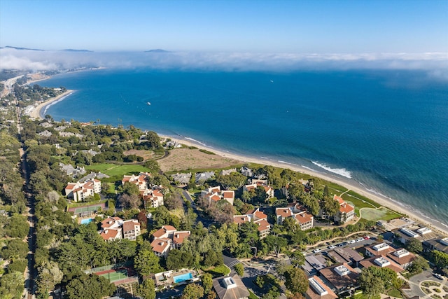 birds eye view of property with a beach view and a water view