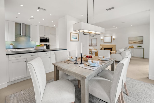 71 Seaview Dr, Santa Barbara, CA 93108 - dining area with recessed lighting, a chandelier, light colored carpet, and a fireplace