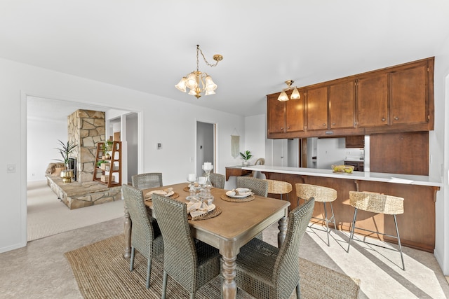 dining space featuring a notable chandelier