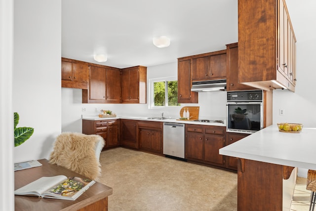 kitchen with sink, black oven, a kitchen bar, light colored carpet, and dishwasher