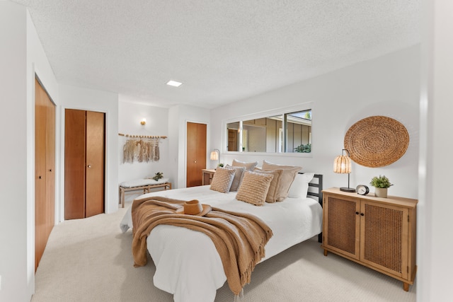 carpeted bedroom with a textured ceiling