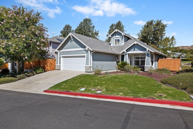 view of front of home featuring a garage and a front lawn