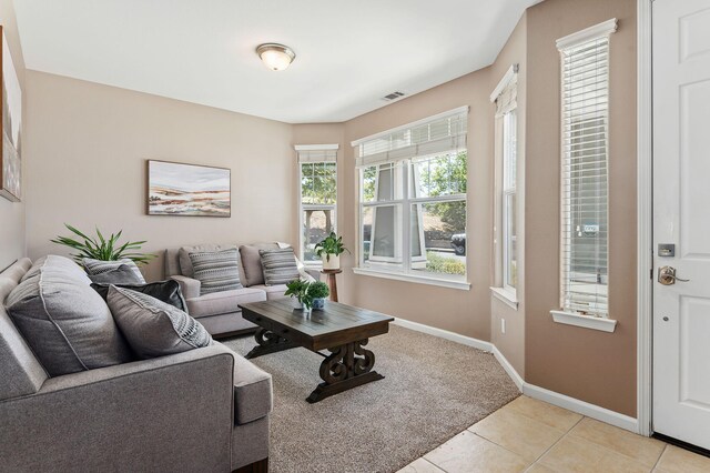 320 Savanna Dr, Los Alamos, CA 93440 - living area featuring baseboards, light tile patterned floors, and light carpet