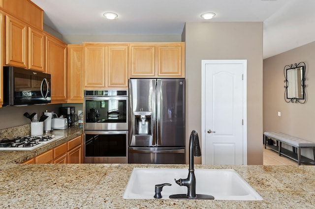 320 Savanna Dr, Los Alamos, CA 93440 - kitchen with stainless steel appliances, a sink, tile patterned floors, and tile countertops