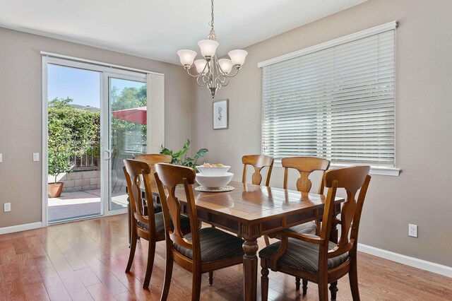 320 Savanna Dr, Los Alamos, CA 93440 - dining area with a chandelier, light wood finished floors, and baseboards