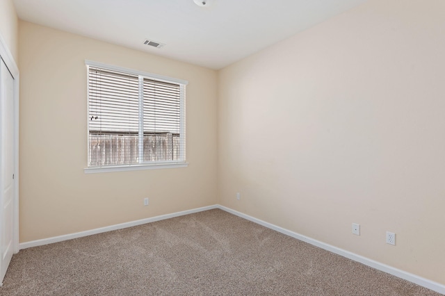 unfurnished room featuring carpet floors