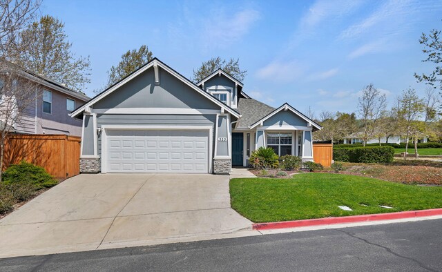 320 Savanna Dr, Los Alamos, CA 93440 - view of front of house with stone siding, a garage, concrete driveway, and a shingled roof
