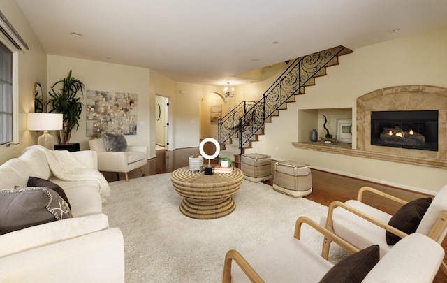 living room with a fireplace and hardwood / wood-style flooring