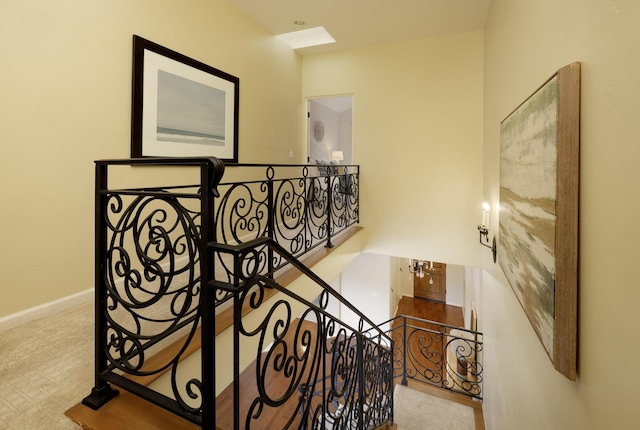 stairs featuring carpet and a notable chandelier