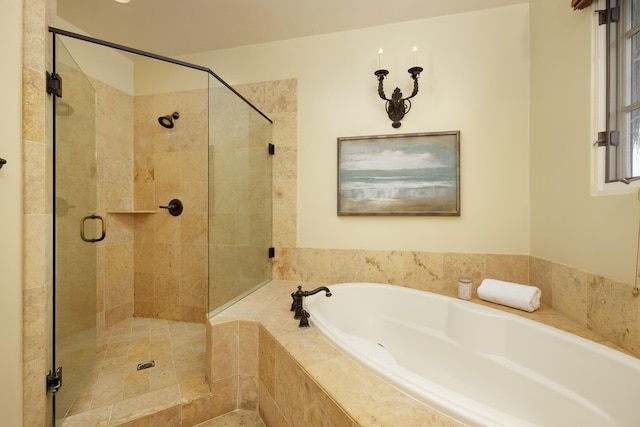 bathroom featuring shower with separate bathtub