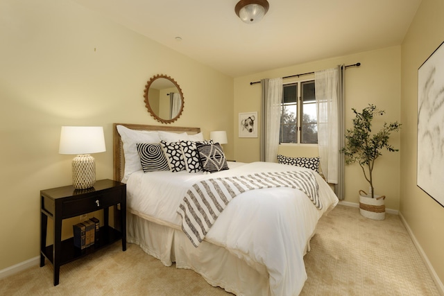 bedroom featuring light colored carpet