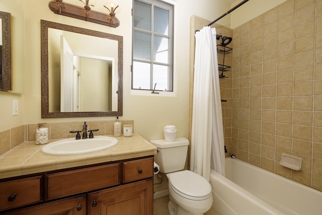 full bathroom with shower / bath combination with curtain, vanity, and toilet