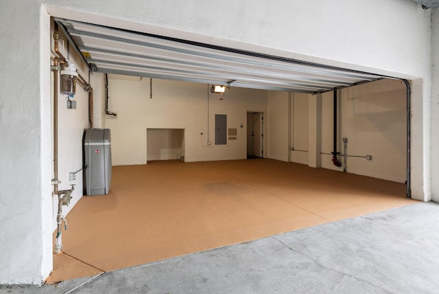 garage featuring a garage door opener and electric panel