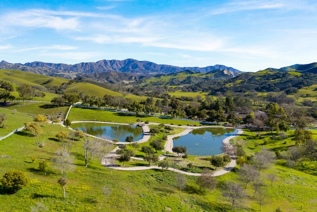 exterior space featuring a water and mountain view