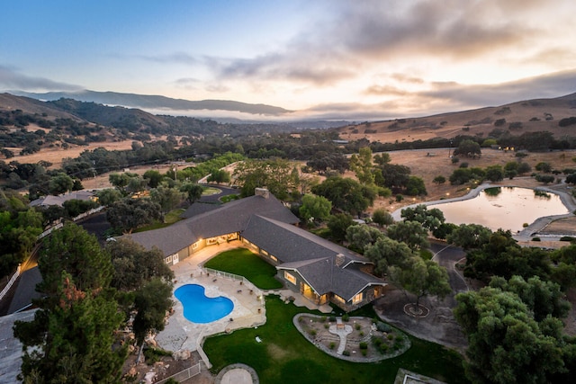 aerial view at dusk with a mountain view