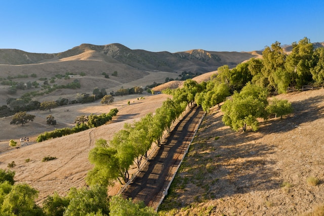 mountain view featuring a rural view