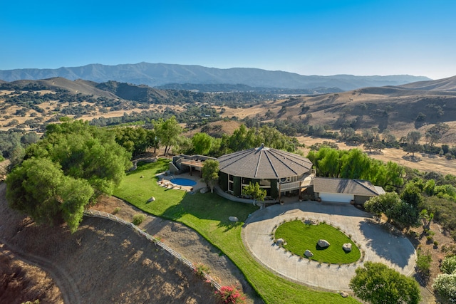 birds eye view of property with a mountain view