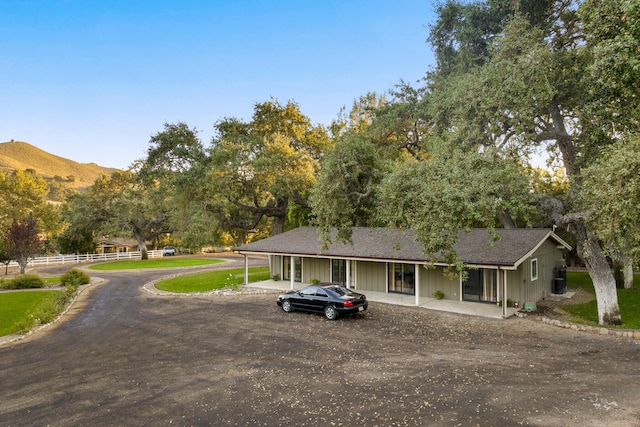 view of front of property with a mountain view