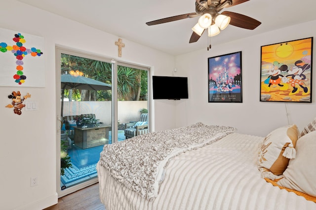 bedroom with ceiling fan, wood-type flooring, and access to outside