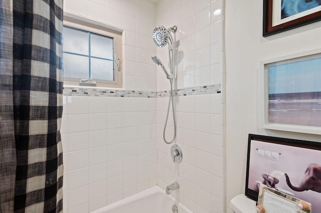 bathroom with toilet and shower / bathtub combination with curtain