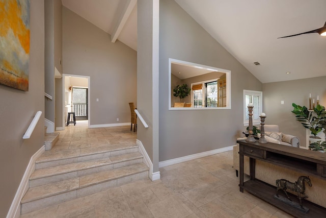 stairs with high vaulted ceiling