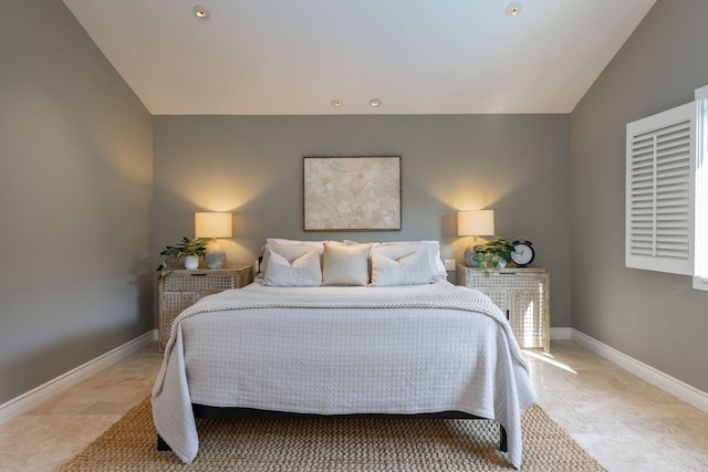 bedroom featuring vaulted ceiling