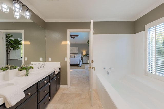 bathroom with vanity, ceiling fan, crown molding, and tiled tub