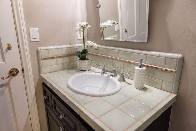 bathroom featuring backsplash and vanity