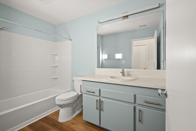 full bathroom featuring toilet, shower / bath combination, vanity, and hardwood / wood-style floors