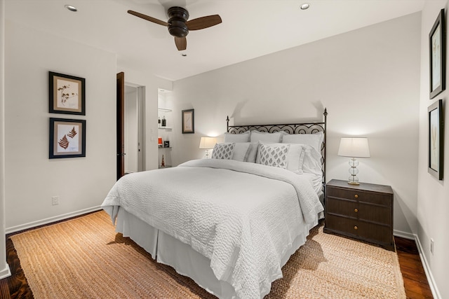 bedroom with hardwood / wood-style flooring and ceiling fan