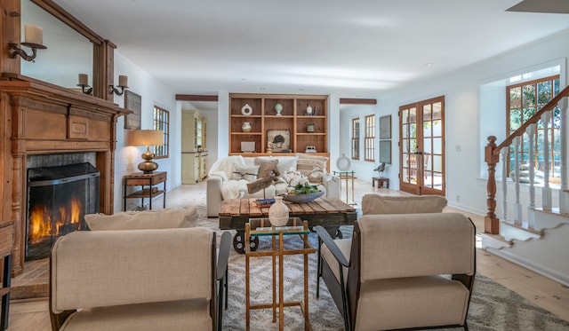 living room featuring light wood-type flooring and french doors