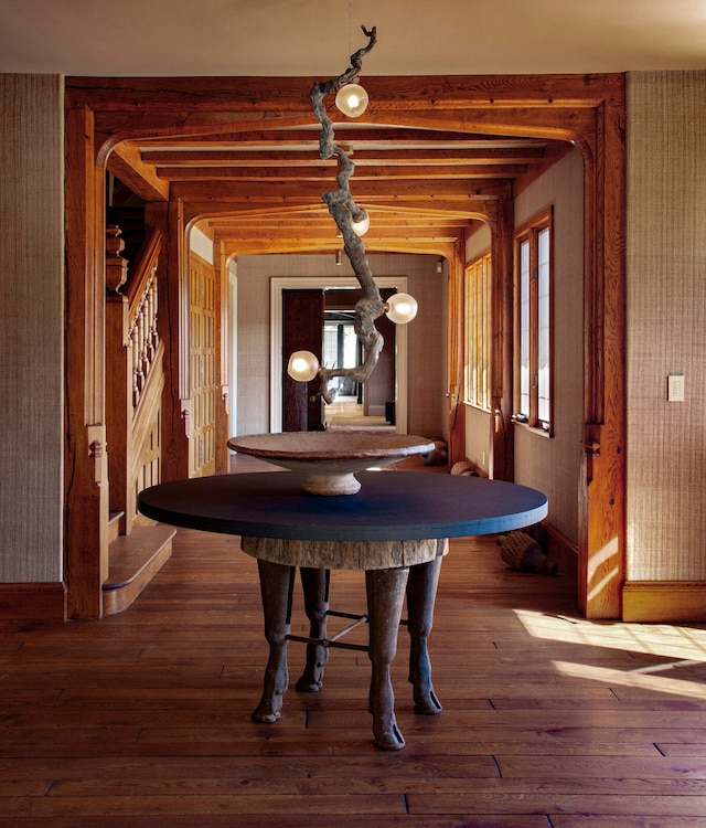 hallway with hardwood / wood-style flooring