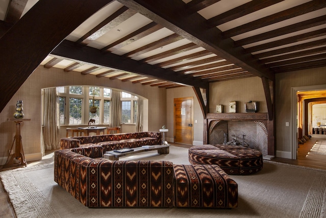 5200 Armour Ranch Rd, Santa Ynez, CA 93460 - living area with beam ceiling, carpet floors, and a brick fireplace
