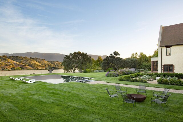 5200 Armour Ranch Rd, Santa Ynez, CA 93460 - view of property's community with an outdoor fire pit, a yard, and a mountain view
