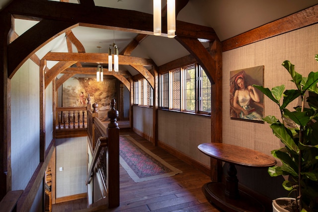 bedroom featuring hardwood / wood-style floors and lofted ceiling with beams