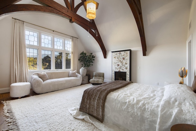 5200 Armour Ranch Rd, Santa Ynez, CA 93460 - bedroom featuring beam ceiling, wood finished floors, a fireplace, and high vaulted ceiling